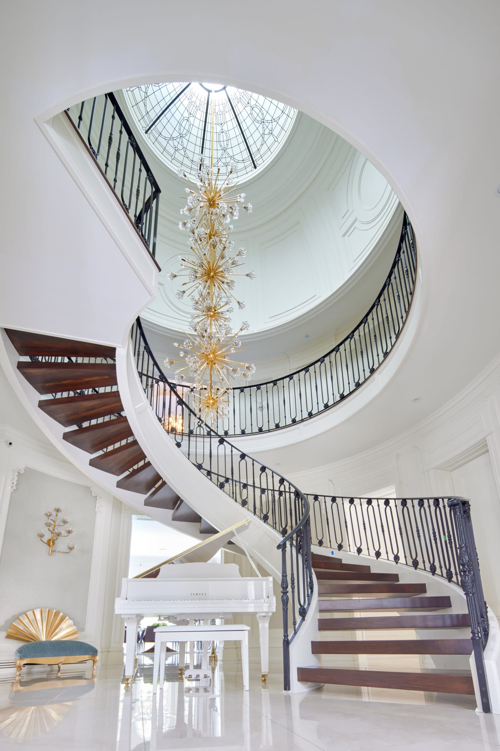 A curved staircase in a Pahlavan Homes custom residence